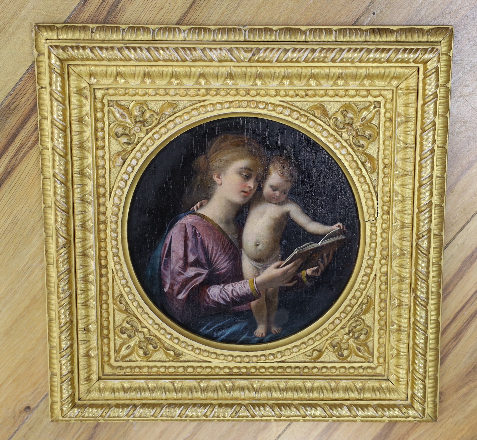 G. Bilancioni (Italian, 1836-1907), oil on cigar box panel, Mother and child reading a book, signed and dated 1874, tondo, 17cm
